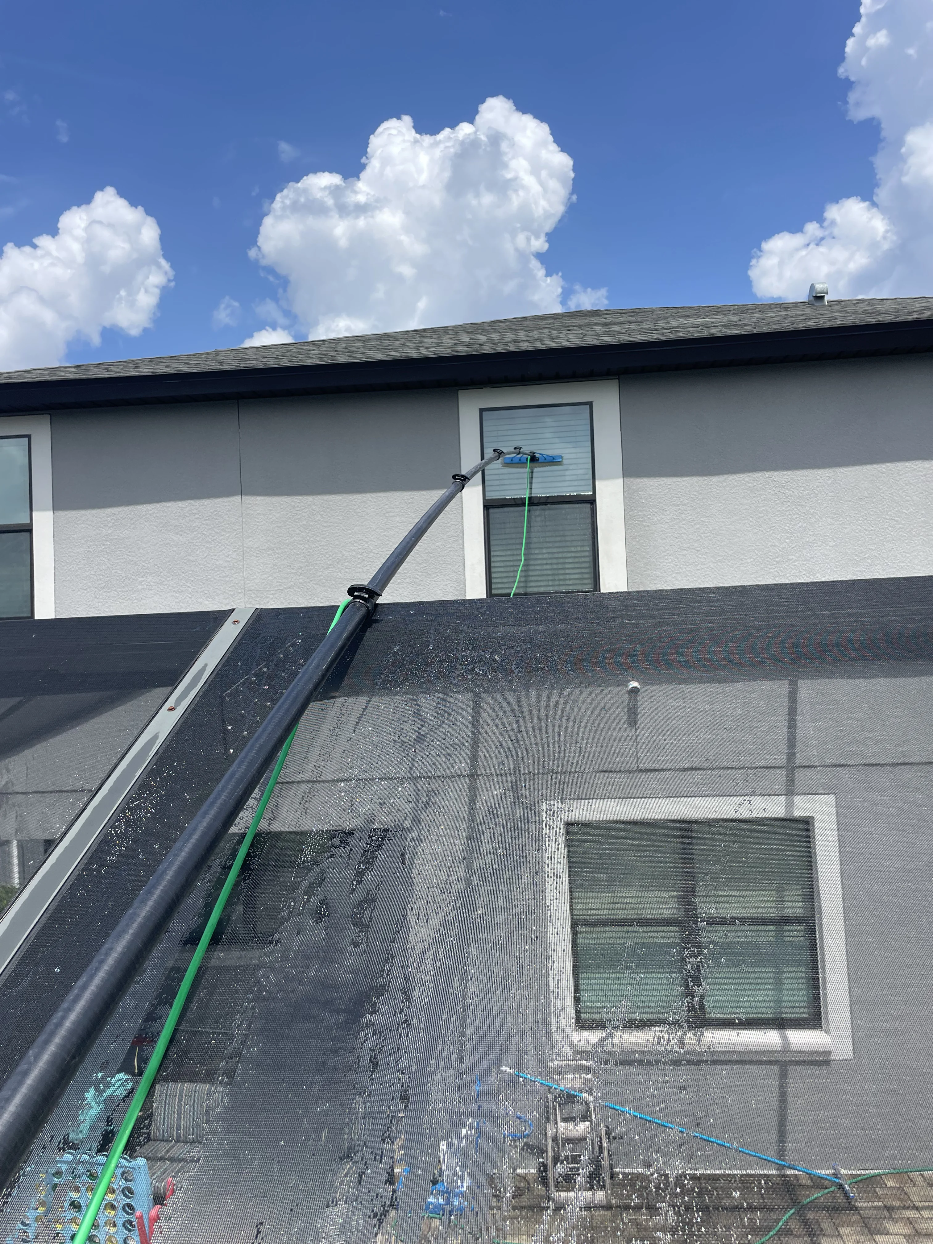 Safe long-reach window cleaning in action by Tampa Bay Shine